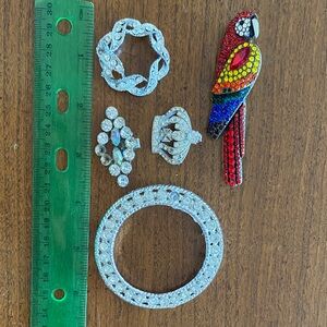 Vintage rhinestone pieces being sold for parts or repair